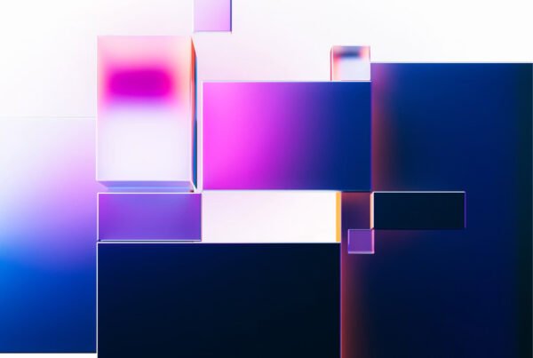 Abstract arrangement of pink, purple, and blue glossy rectangular blocks on a pale gradient background.