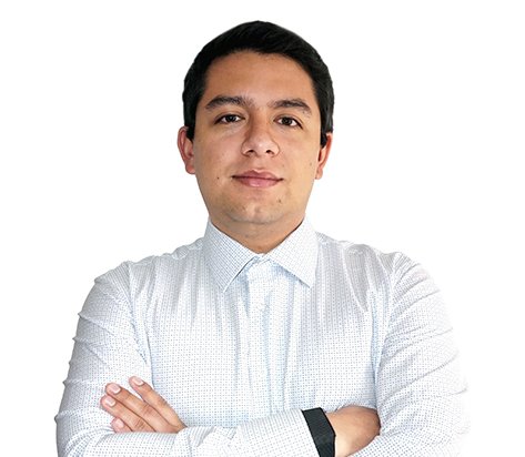 Professional portrait of a man with arms crossed, wearing a light dress shirt, looking at the camera against a white background.